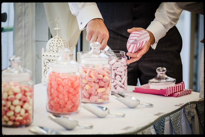 Sweets in mason jars at a wedding