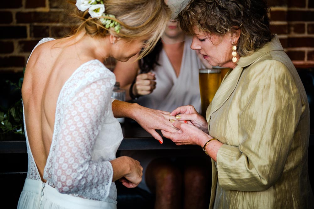 Admiring the bride's wedding ring