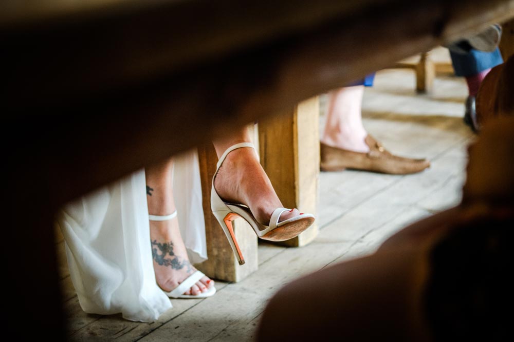 The bride's shoes under table