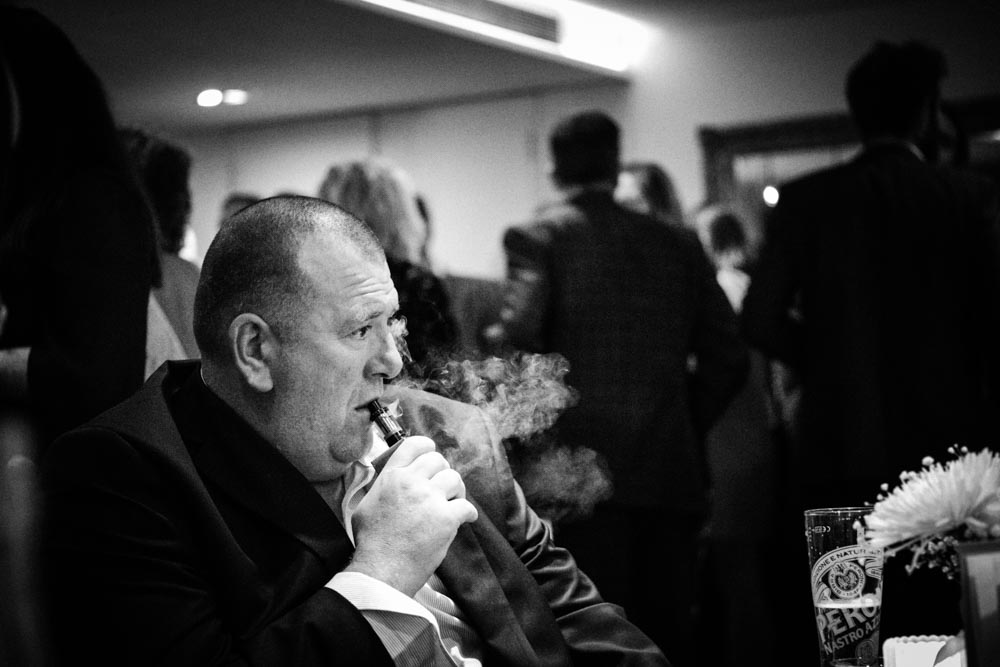 Wedding guest smoking e-cigarette